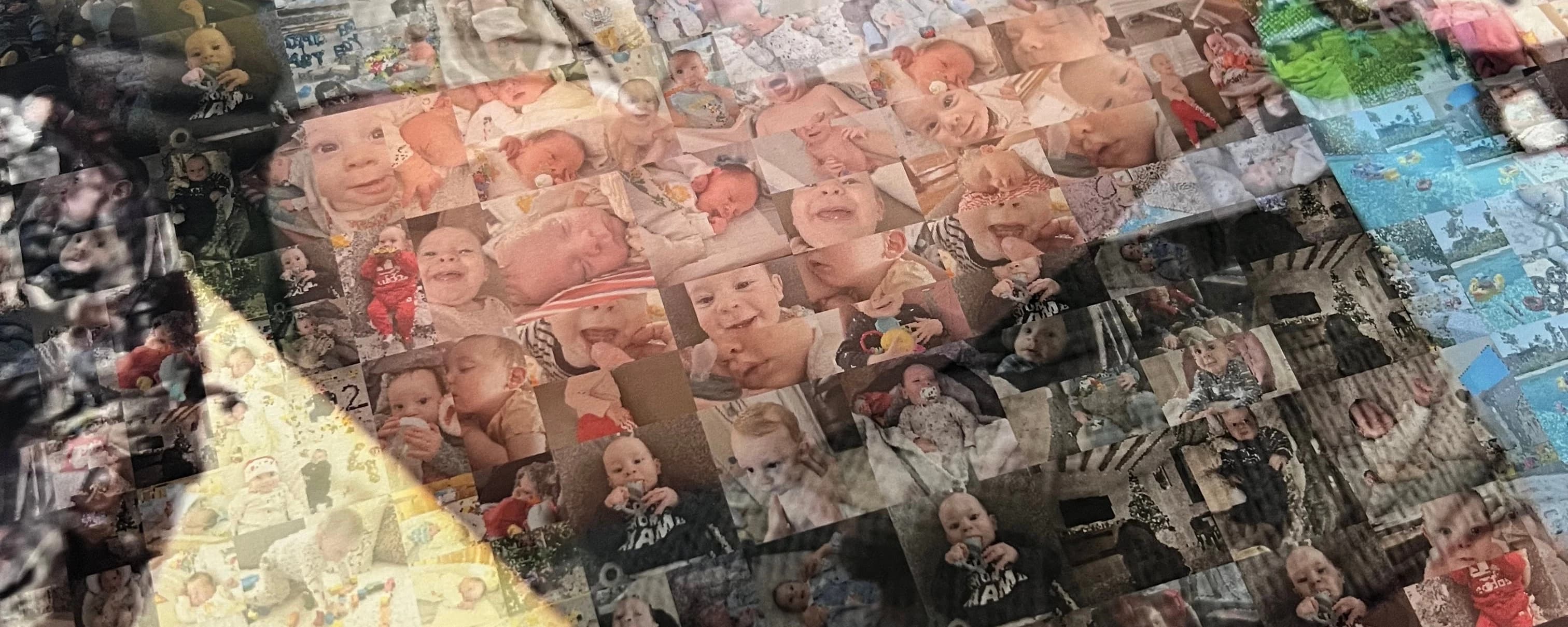 Macro photo of a real printed MosaicFace piece at a raking angle, showing individual photo tiles and the physical paper surface