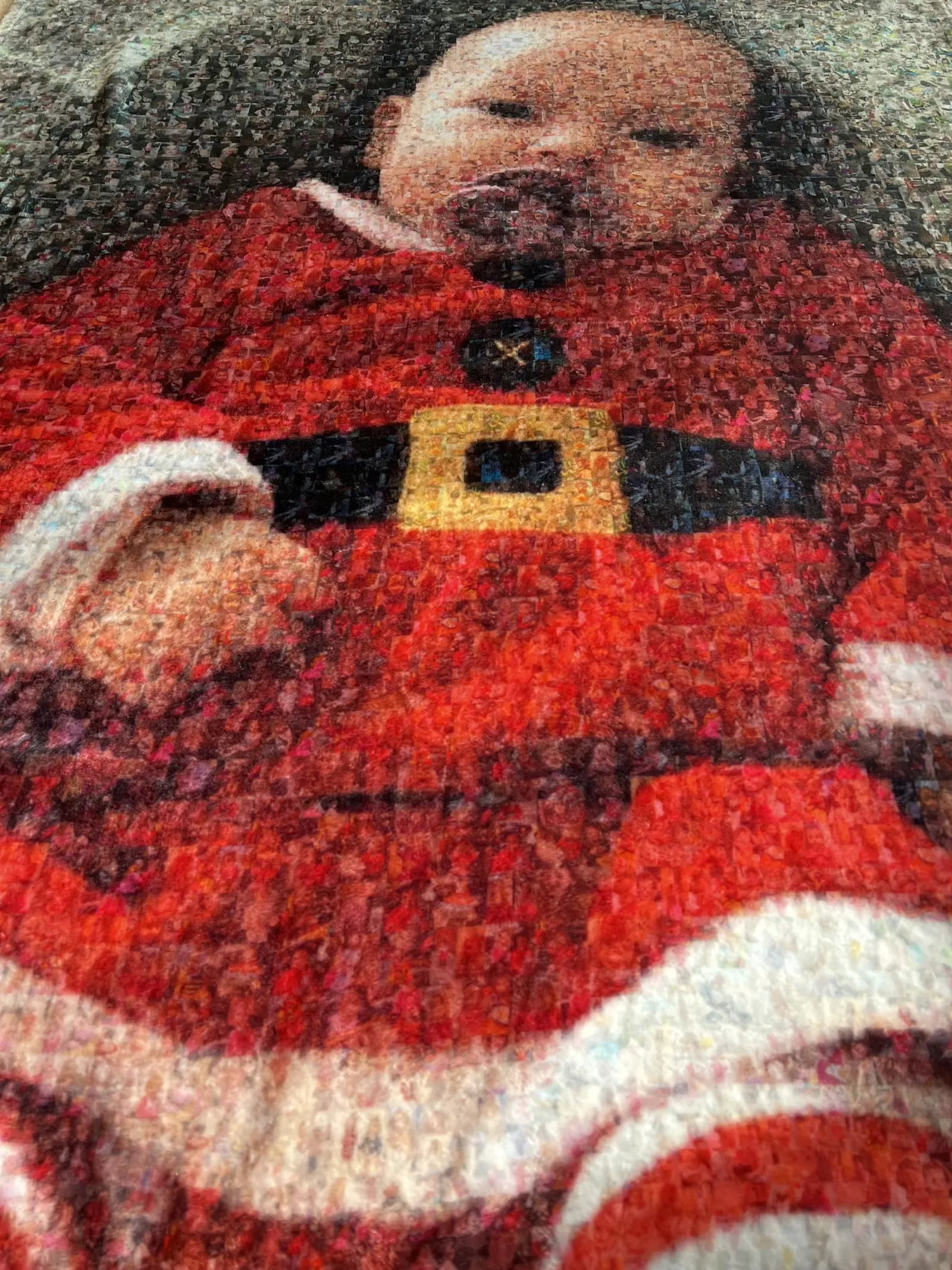 Close-up of a photo mosaic blanket, every tile is a small photo